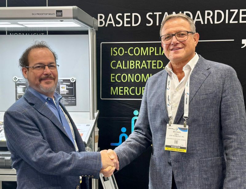 Lou Prestia and Just Normlicht representative shaking hands at Printing United Expo 2025
